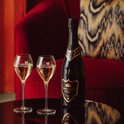 A lifestyle image of Hattingley Valley Kings Cuvée with a luxurious lifestyle background