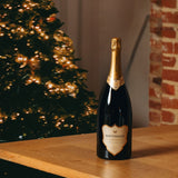 Bottle of Hattingley sparkling wine Classic Reserve NV Magnum on a wooden surface with a neutral background