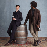 Hattingley Valley Lifestyle image, two English gents laughing and enjoying a glass of Hattingley Valley Blanc de Blancs