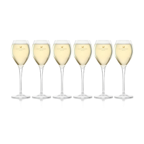 Hattingley Valley Tulip Flutes (Glasses Full), glasses are branded with the Hattingley Valley logo and butterfly. Fine glassware for drinking at home or giving as the perfect wine gift.