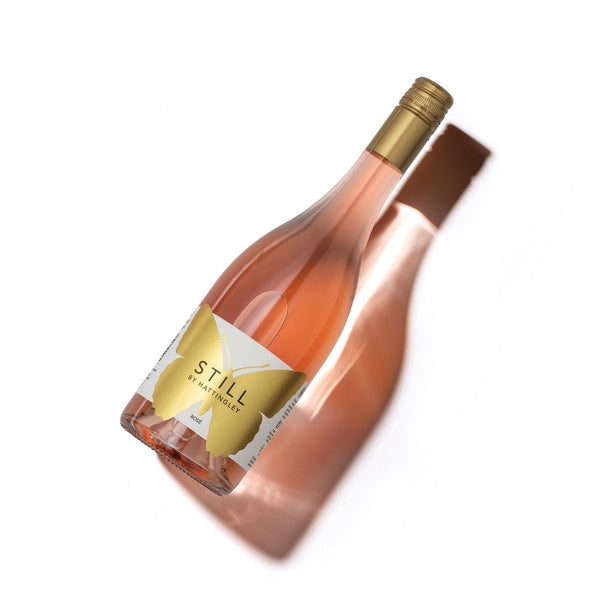 Hattingley Valley Still Rosé 2022 | Bottle Image on white background, salmon pink wine in clear bottle with label with large butterfly logo