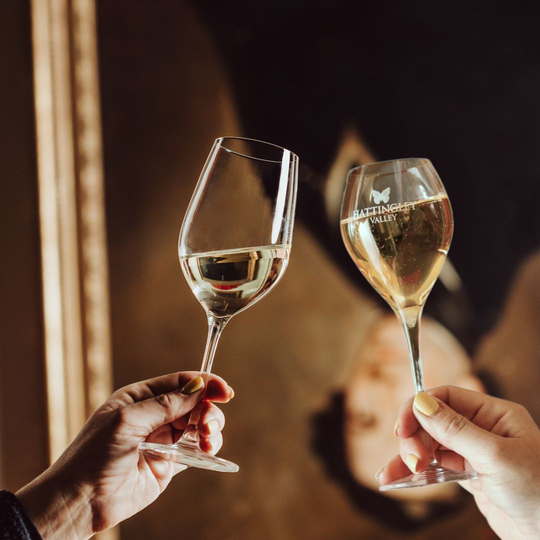 Hattingley Valley lifestyle image, still and sparkling glasses cheers-ing, luxurious hotel backgroud
