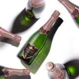 Hattingley Valley Kings Rosé Case, premium english sparkling wine, multiple Kings Rosé bottles at different angles casting shadows on the white background
