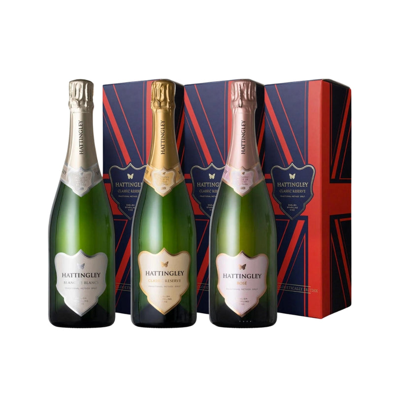 trio of English Sparkling Wines Hattingley Valley Classic Reserve, Blanc de blancs and English Sparkling Rosé beside three union jack gift boxes on a white background