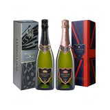 Christmas prestige gift of English Sparkling Wines Hattingley Valley Kings Cuvée and Kings Rosé prestige cuvée wine bottles beside two gift boxes on a white background
