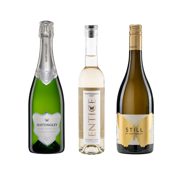 Bottle shots on a white background. Bottles in order are Hattingley Valley Blanc de Blancs English Sparkling, Entice English Dessert wine and Still Chardonnay.