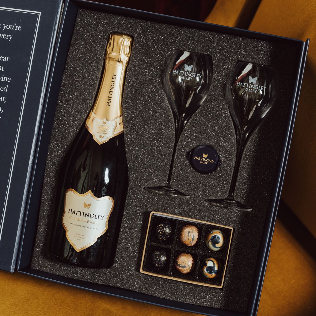 Hattingley Valley Corporate Gift Set, bottle of Hattingley Valley Classic Reserve with two glass flutes and a box of chocolates in a gift box, deliver to your door