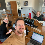 Image of Susie, Peter and our old head winemaker Emma Rice, in our tasting room smiling and tasting wine 